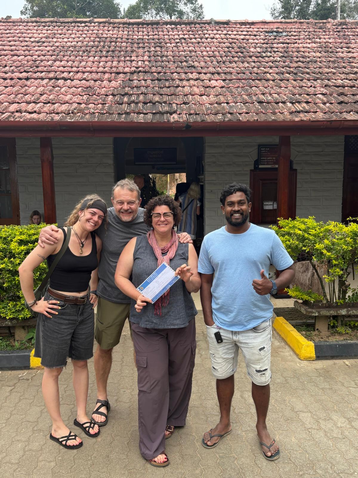 Kanishka with three smiling guests at the end of a day on the road in Sri Lanka