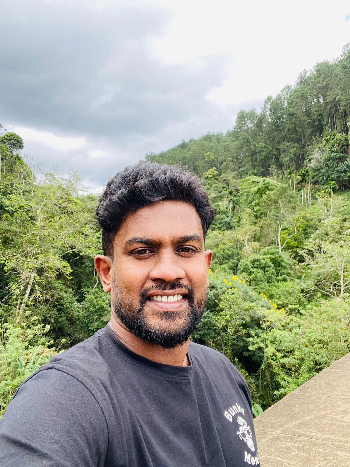 Kanishka Hannadi, tour guide, in the Sri Lankan jungle wearing a Bunky Monkey t-shirt