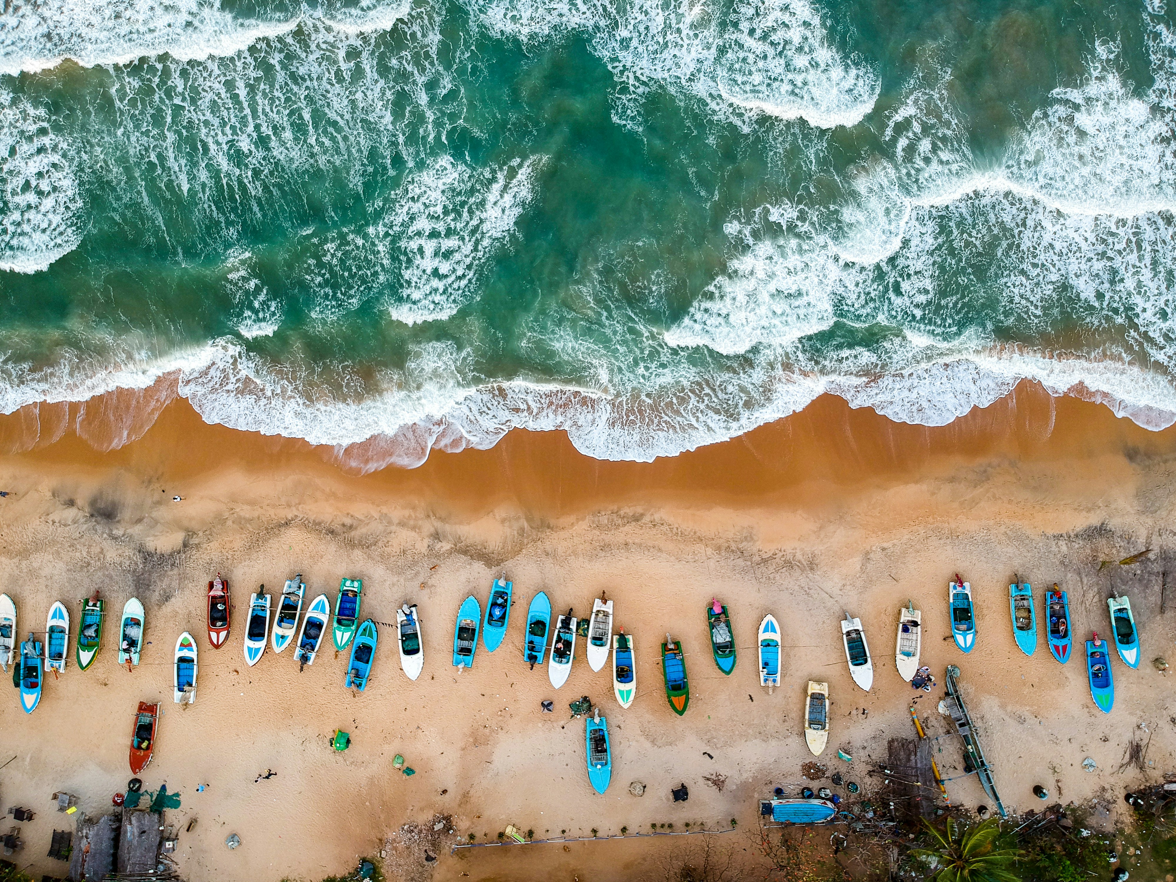 Fishing boats on the shore at Arugam Bay, Sri Lanka, seen from the air