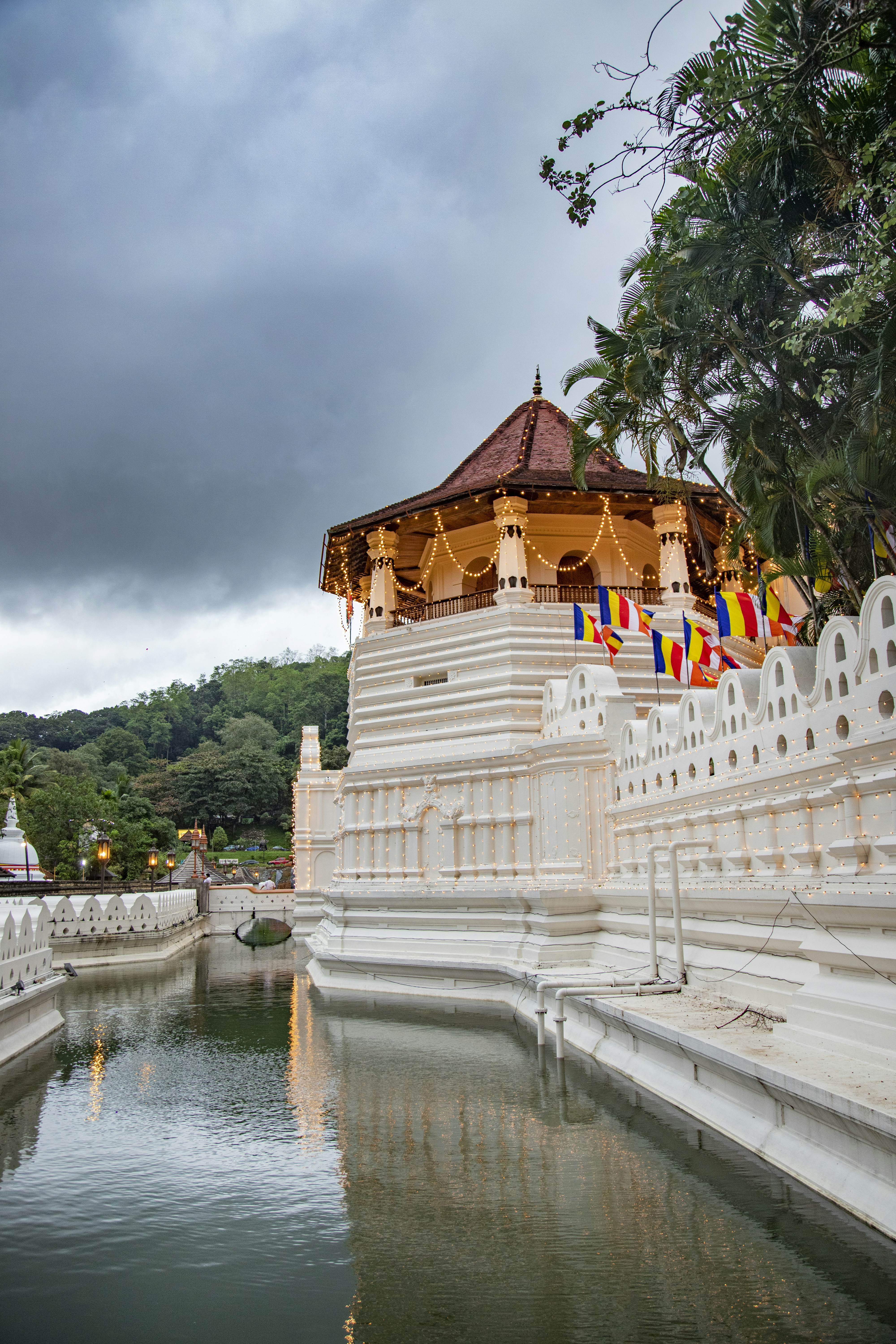 The Temple of the Tooth Relic in Kandy, Sri Lanka, reflected in the lake